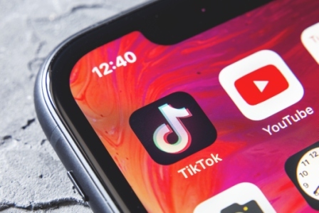 An image of the TikTok app on a smartphone