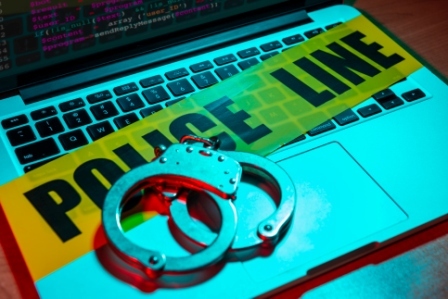 Handcuffs on a laptop keyboard